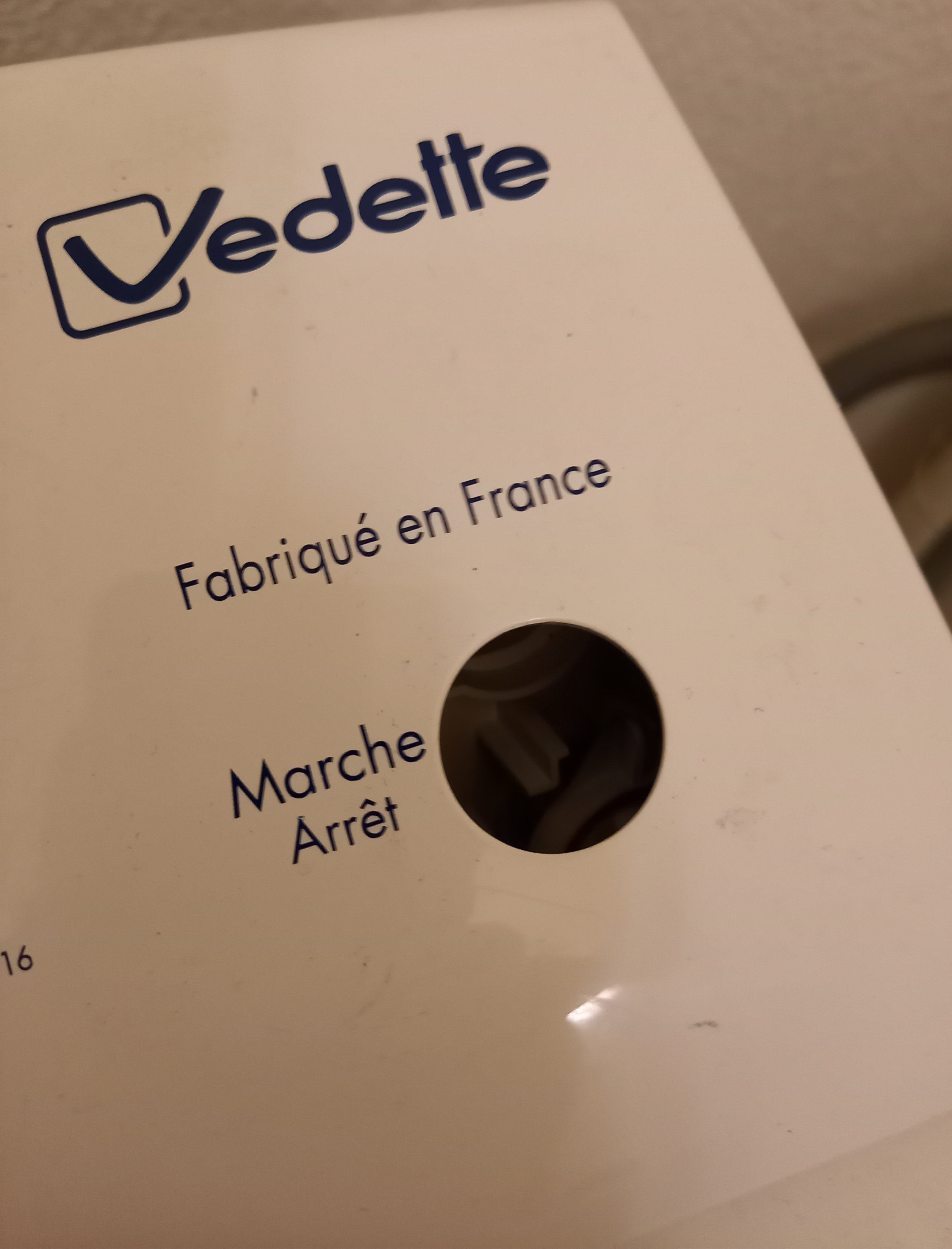 Le bouton de ma machine à laver est tombé à l'intérieur.